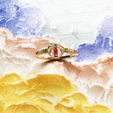 Golden ring with colorful palm tree emblem