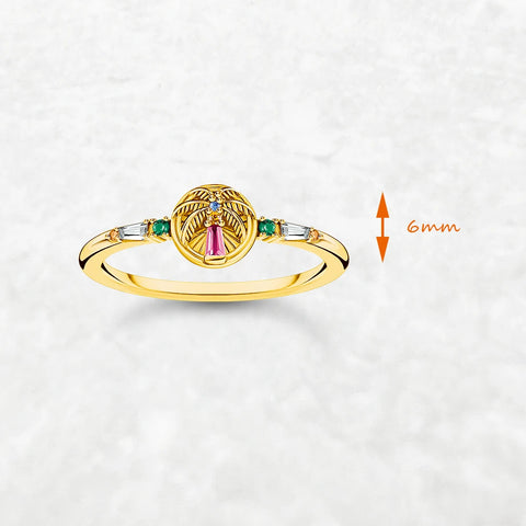 Golden ring with colorful palm tree emblem