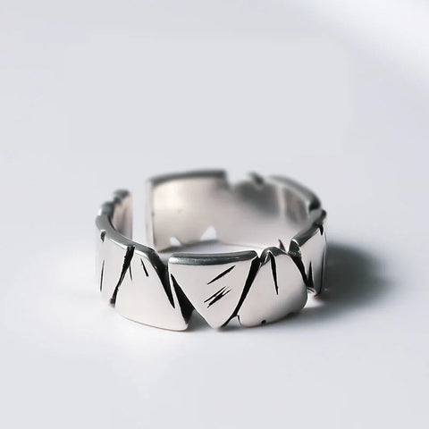 Men's ring made of silver with an irregular structure and a modern design