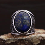 Men's ring with blue lapis lazuli and angel design in antique silver
