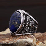 Men's ring with blue lapis lazuli and angel design in antique silver
